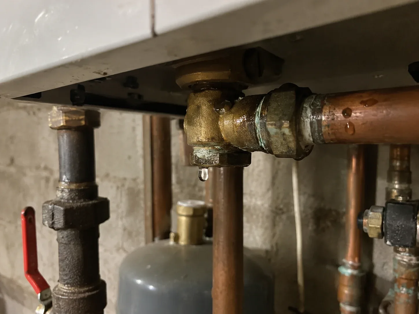 Water dripping from an older boiler connection